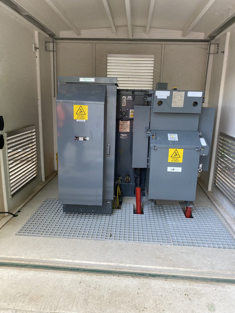 Packaged substation interior with Schneider Electric and Lucy Electric switchgear and transformer installed by Aquamain